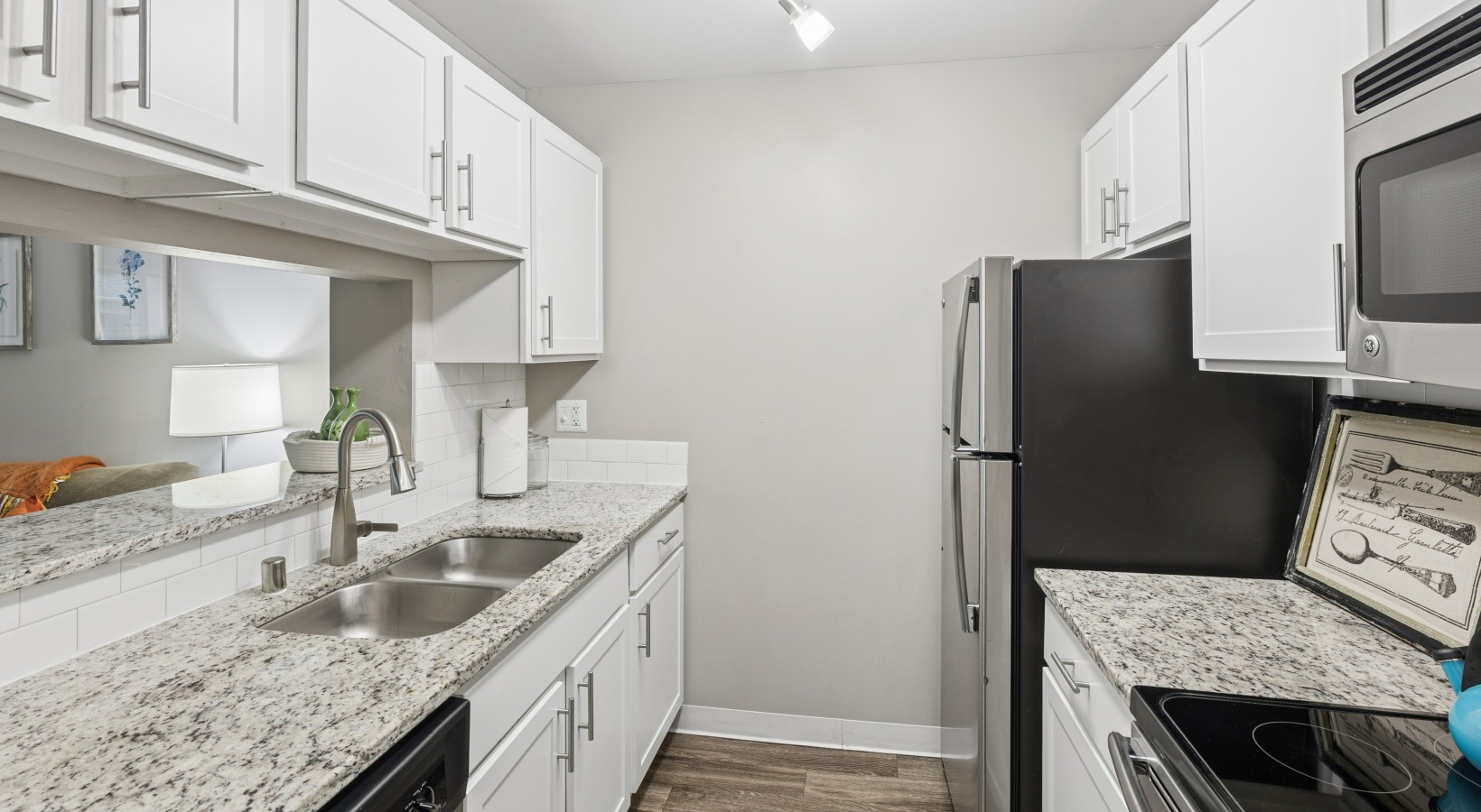 a kitchen with white cabinets