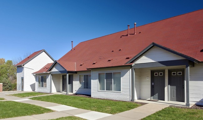 Apartment building exterior with a red roof
